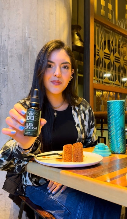 Woman enjoying a refreshing cup of organic Guayusa tea indoors, promoting natural energy, focus, herbal wellness, and healthy daily routines.